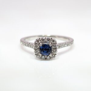 Our Pre-Loved Cushion Cut Sapphire and Diamond Halo Ring is set in a beautiful 14ct White Gold