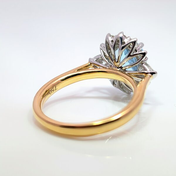 This exquisite ring features a oval centre 1.85ct aquamarine, surrounded by a halo of 0.70ct diamonds. Crafted with precision, the band is made of 18ct yellow perfect for special occasions or as a statement piece in your everyday collection.