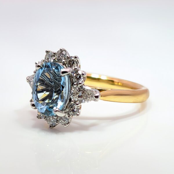 This exquisite ring features a oval centre 1.85ct aquamarine, surrounded by a halo of 0.70ct diamonds. Crafted with precision, the band is made of 18ct yellow perfect for special occasions or as a statement piece in your everyday collection.