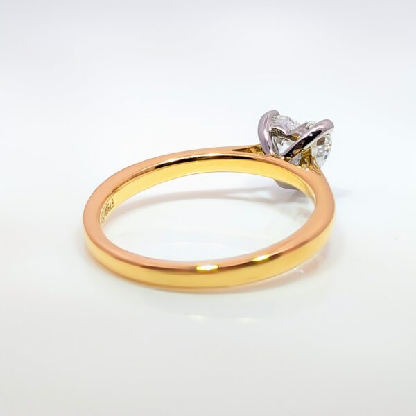 This romantic Heart Shaped Lab Grown Diamond is set in an 18ct yellow gold and platinum band. With a D Colour and VS1 Clarity you'll have hearts beating when they see it. Perfect for Valentine's and special occasions. IGI Certificated.