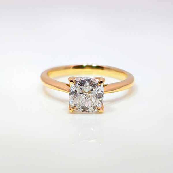 This exquisite gold ring features a stunning square-cut ‘cushion’ diamond that captures the light beautifully. Set in an 18ct yellow gold band with tallon claws it's an excellent choice for your engagement ring.