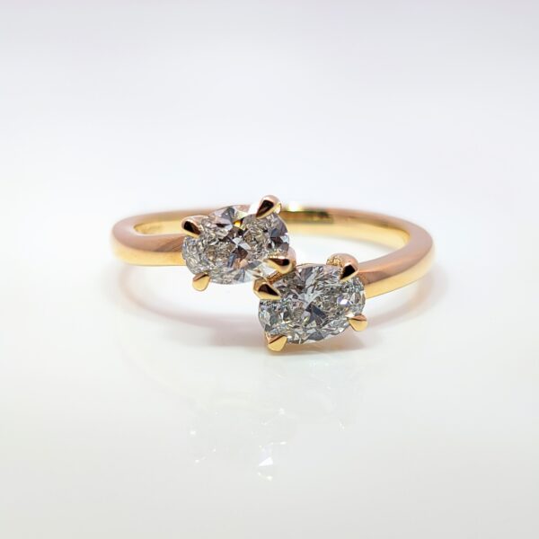 The 2 stone engagement ring is a symbol of the intertwined journey of two hearts. This 9ct yellow gold Oval Two Stone Lab Grown Diamond Ring has a total carat weight of 1 carat.