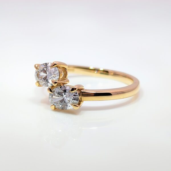 The 2 stone engagement ring is a symbol of the intertwined journey of two hearts. This 9ct yellow gold Oval Two Stone Lab Grown Diamond Ring has a total carat weight of 1 carat.