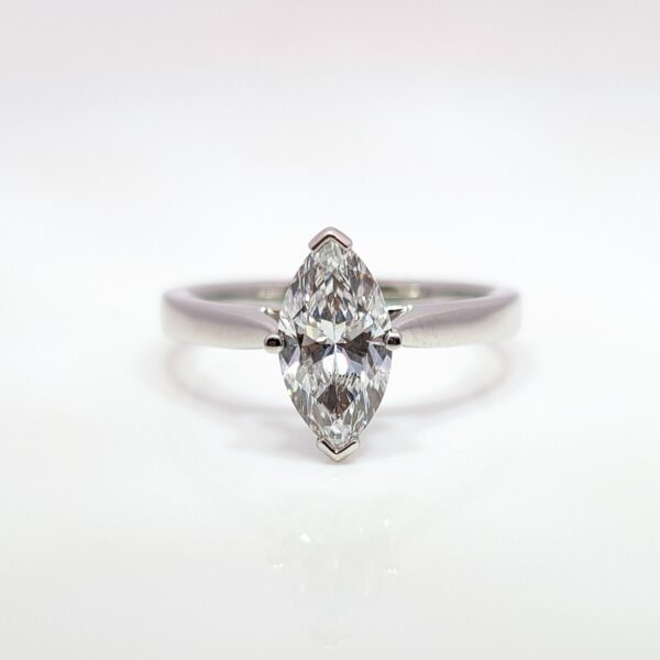 Discover the timeless beauty of this lab grown marquise diamond ring, making it an ethical and sustainable choice for your engagement ring. The stunning diamond is elegantly set in a platinum band.